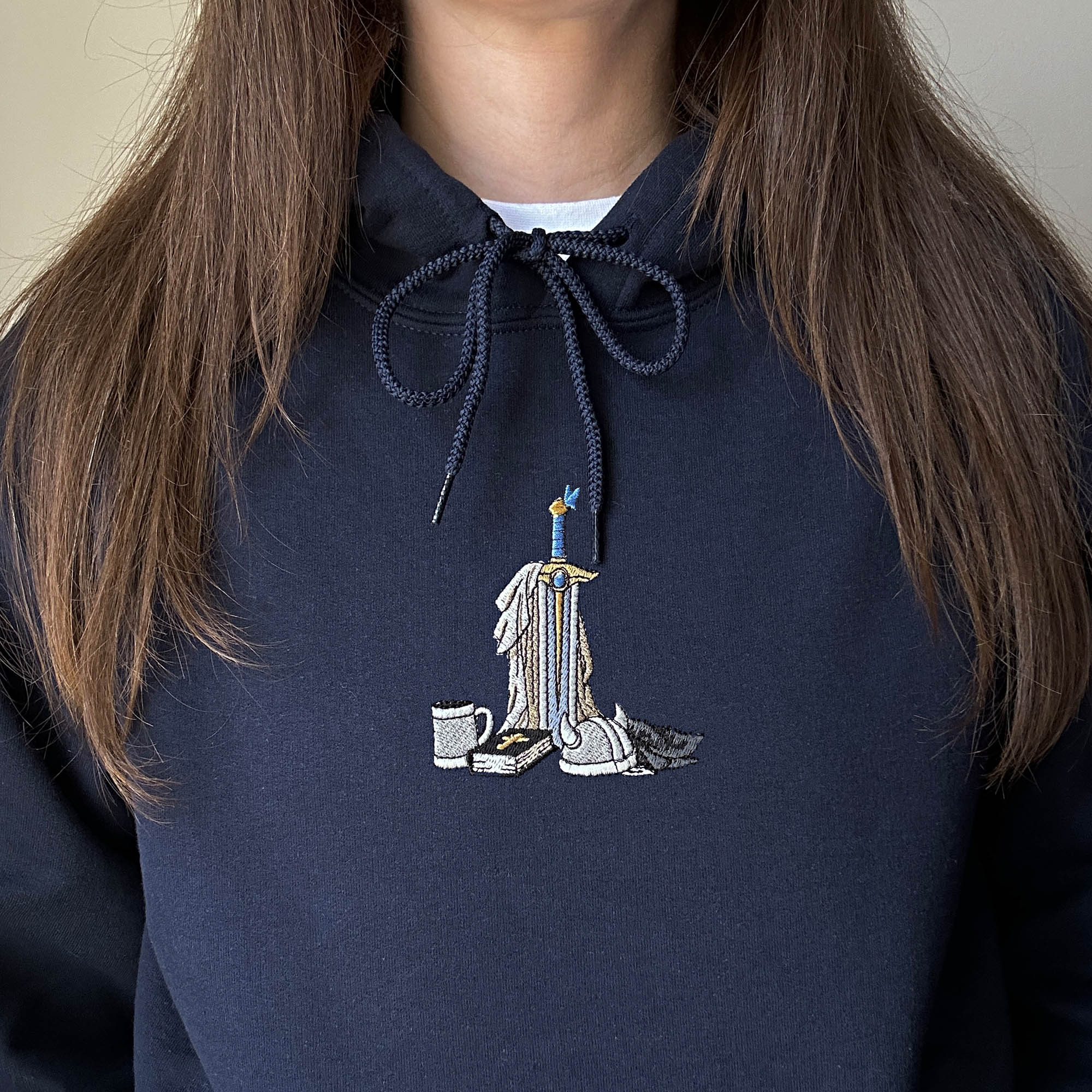 Sword and book embroidery design