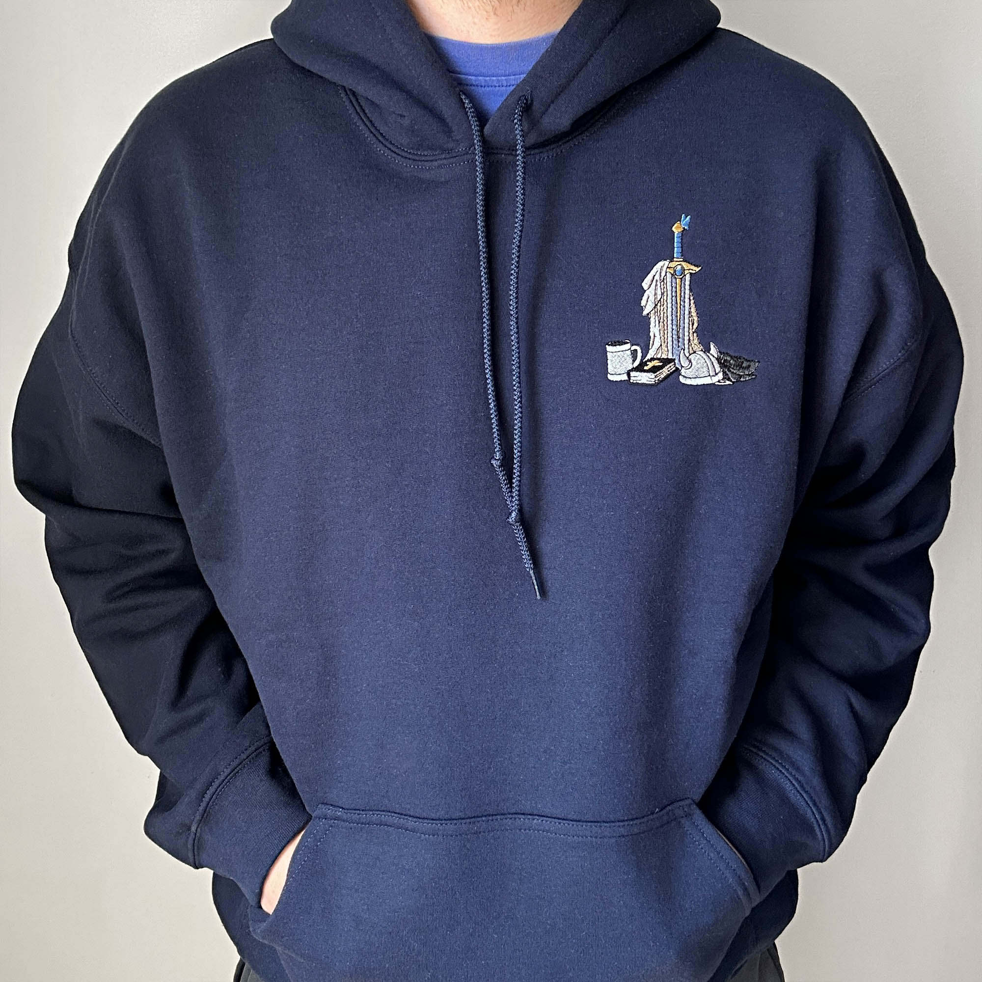 Sword and book embroidery design