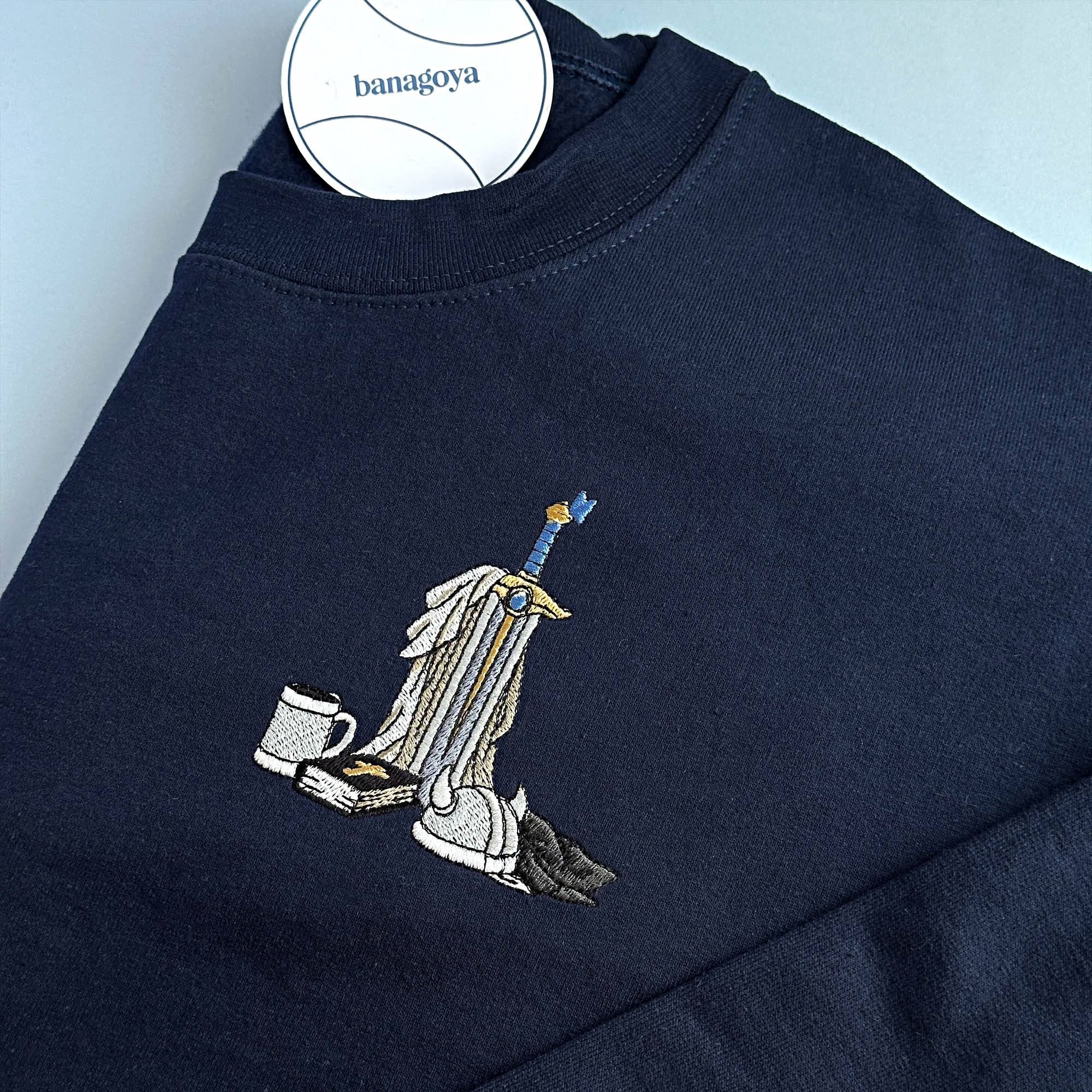 Sword and book embroidery design