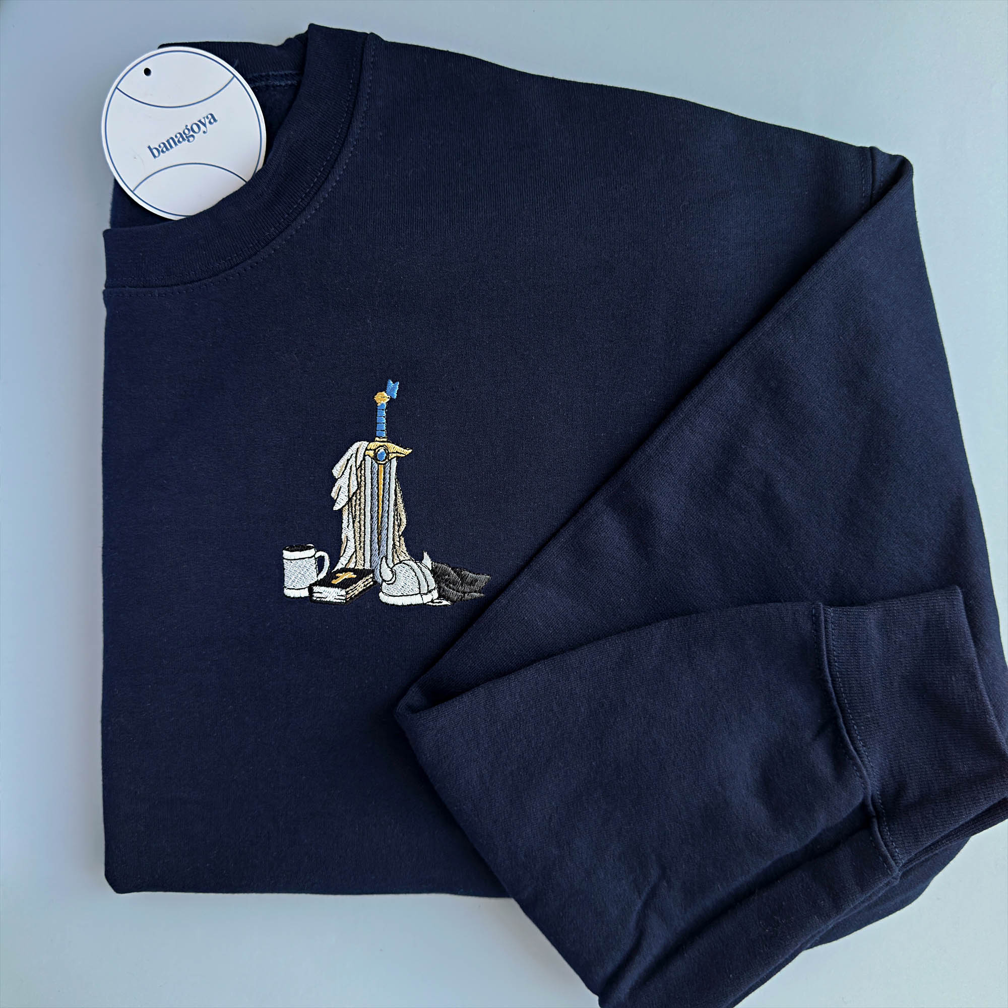 Sword and book embroidery design