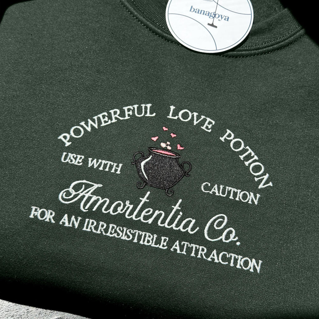 Wizard cauldron with love potion embroidery design