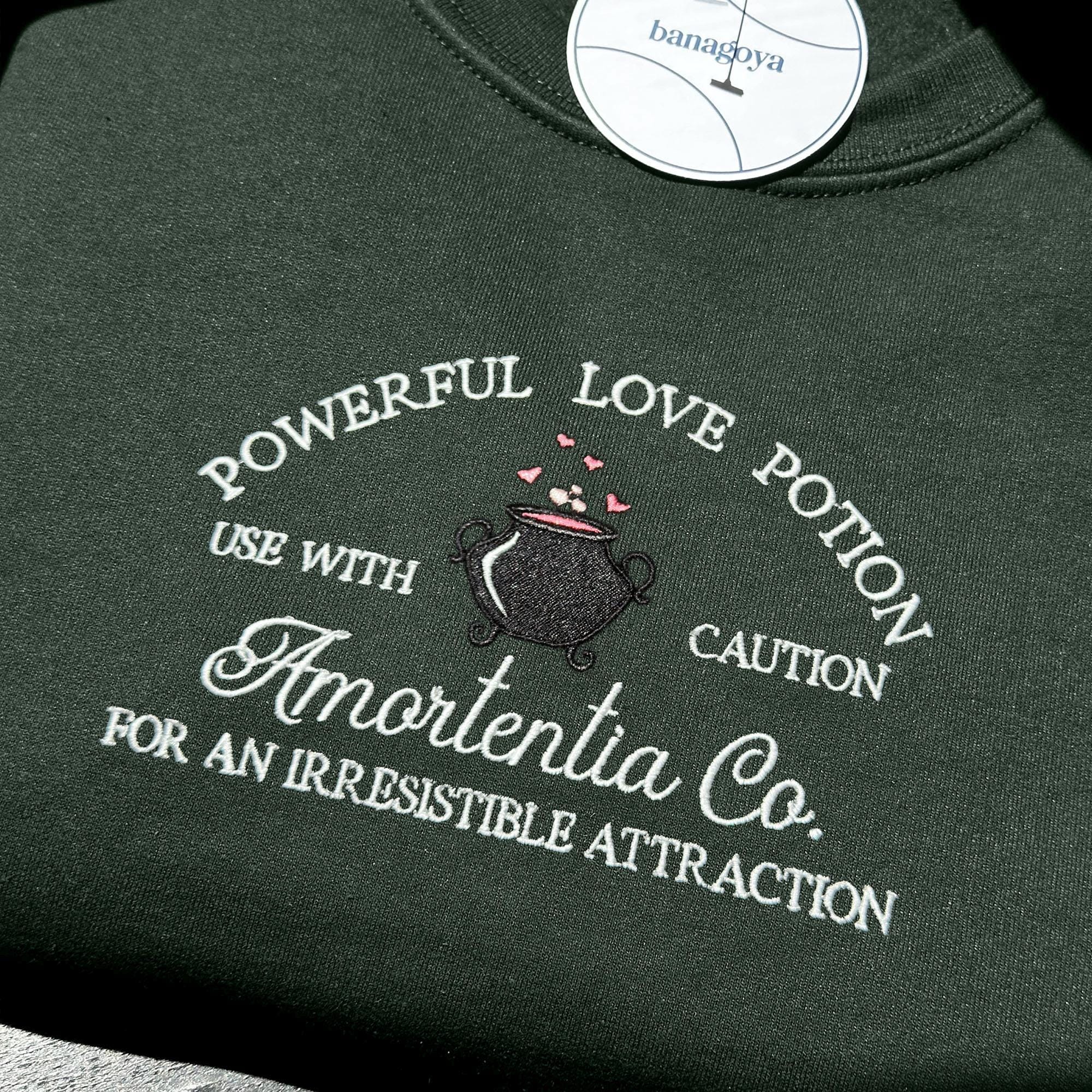 Wizard cauldron with love potion embroidery design