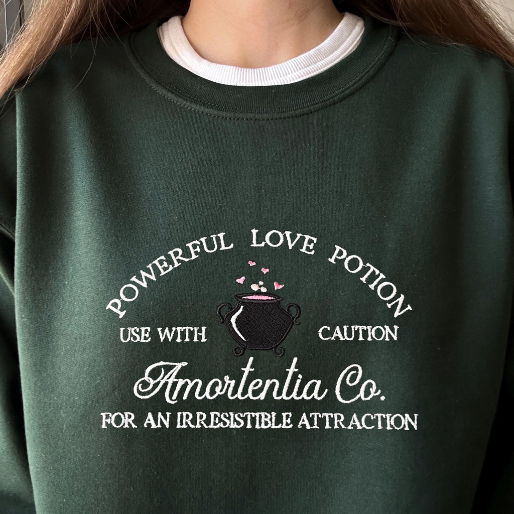 Wizard cauldron with love potion embroidery design