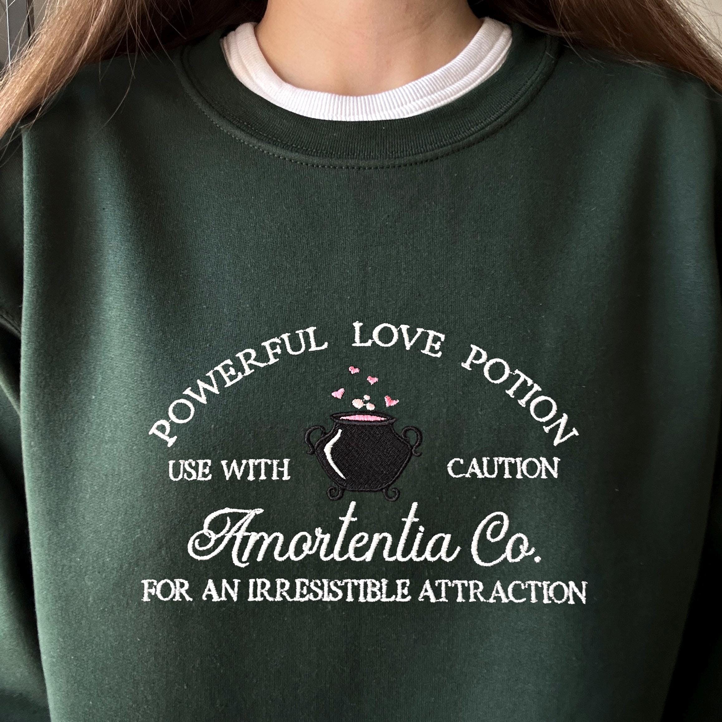 Wizard cauldron with love potion embroidery design