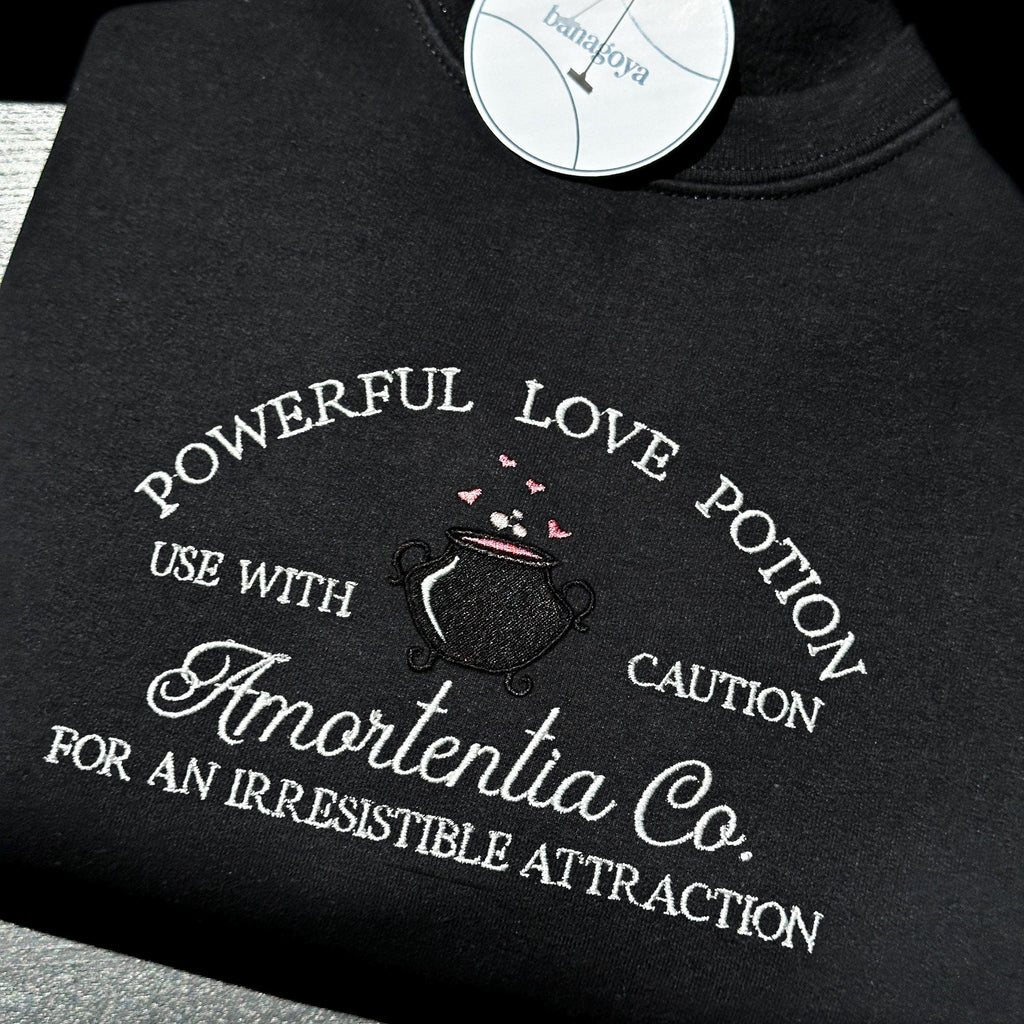 Wizard cauldron with love potion embroidery design