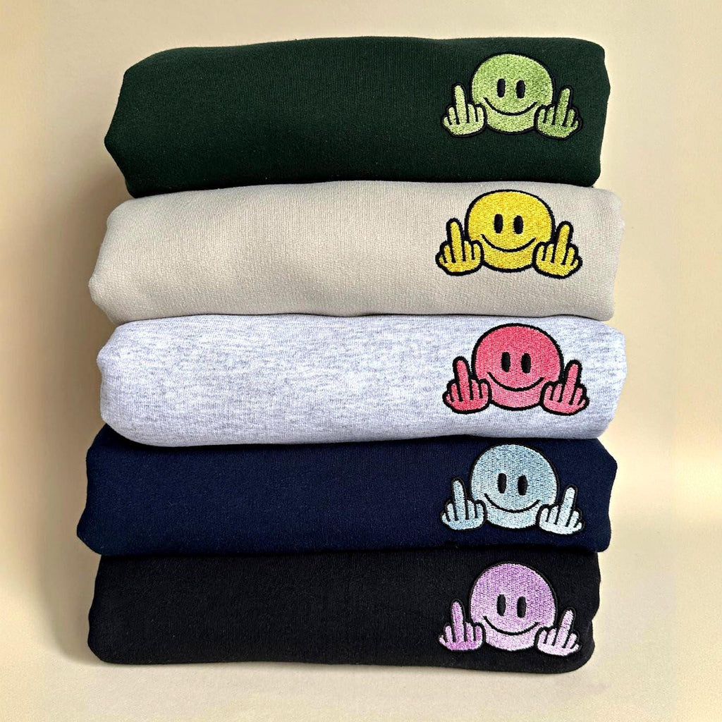 Smiley face with middle finger embroidery design