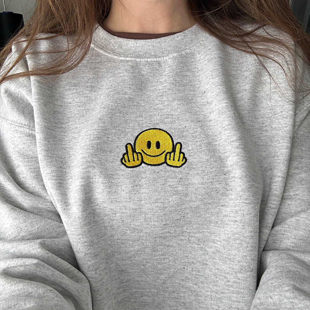 Smiley face with middle finger embroidery design